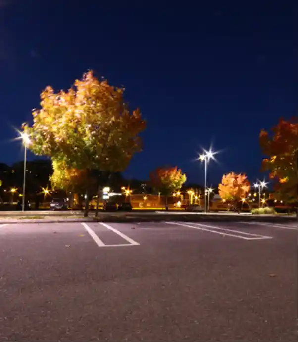 Parking lot enhanced by M&I with improved curb appeal through professional lighting and maintenance.