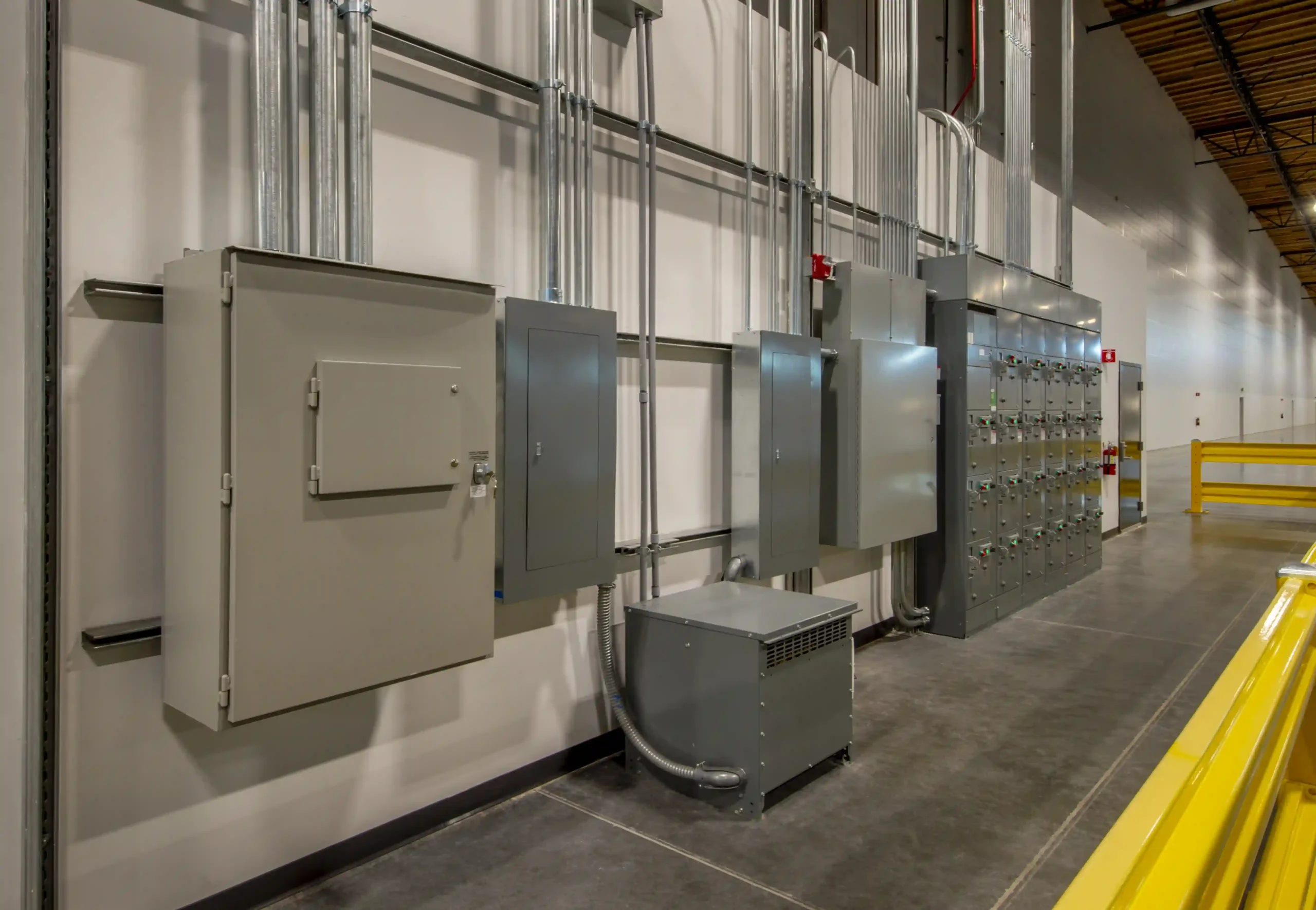 Technician performing emergency electrical repairs for a commercial building.